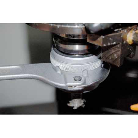 Clé à ergot articulée pour écrous à encoches latérales 